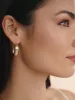 Oval Dome Baguette Hoops sold by ettika