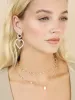Loving Pearl Heart Earrings sold by ettika