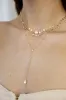 Forever Falling Pearl Lariat sold by ettika