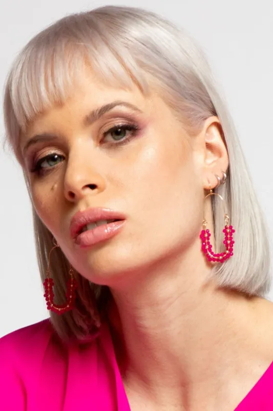 Fuchsia Daisy Pendant Earring sold by Eva Franco