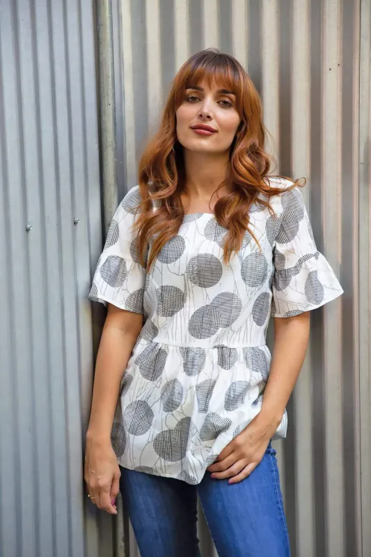 Polka Dot Peplum Tunic sold by Eva Franco