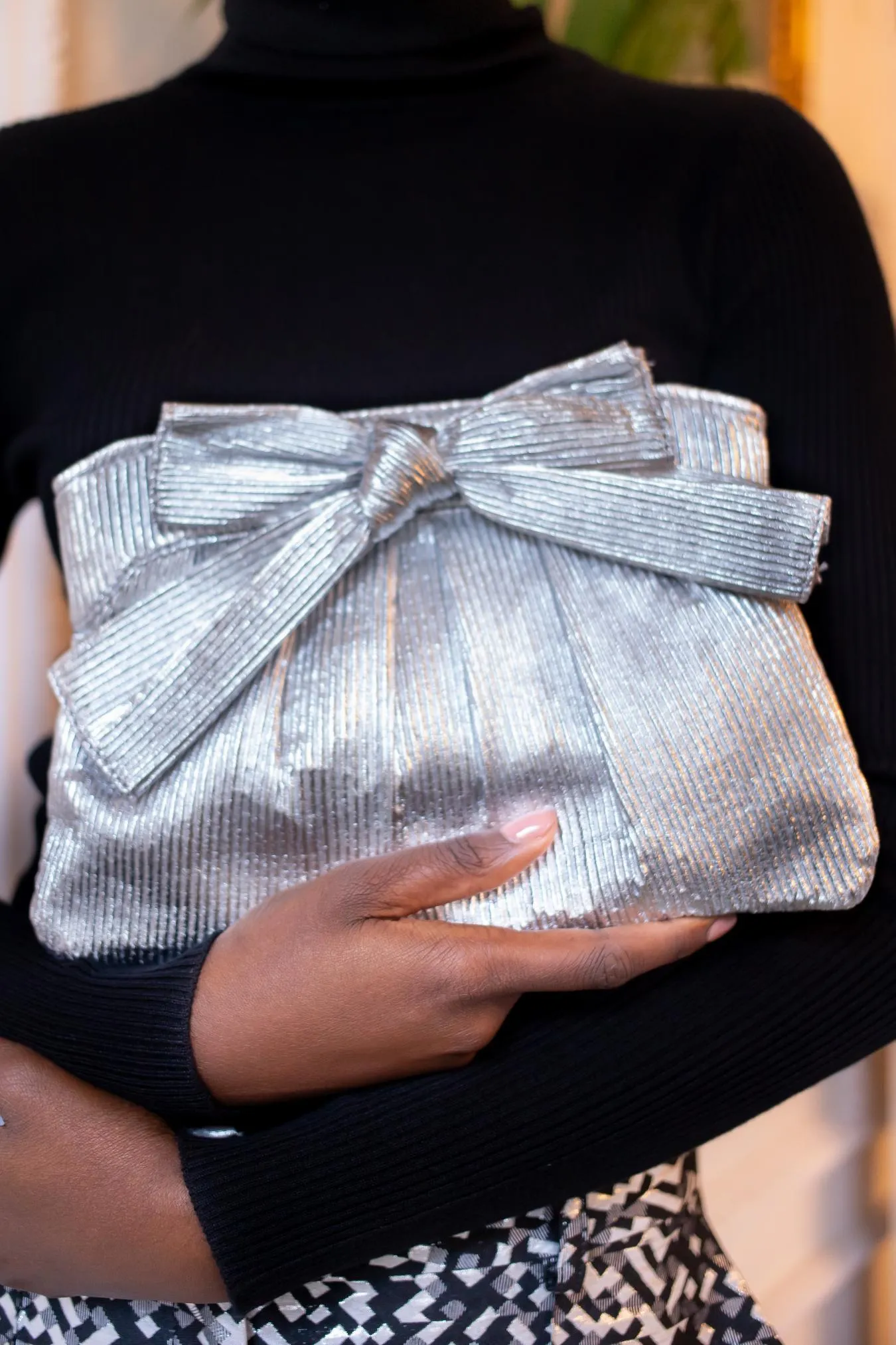 Silver Pleated Bow Clutch Bag sold by Eva Franco