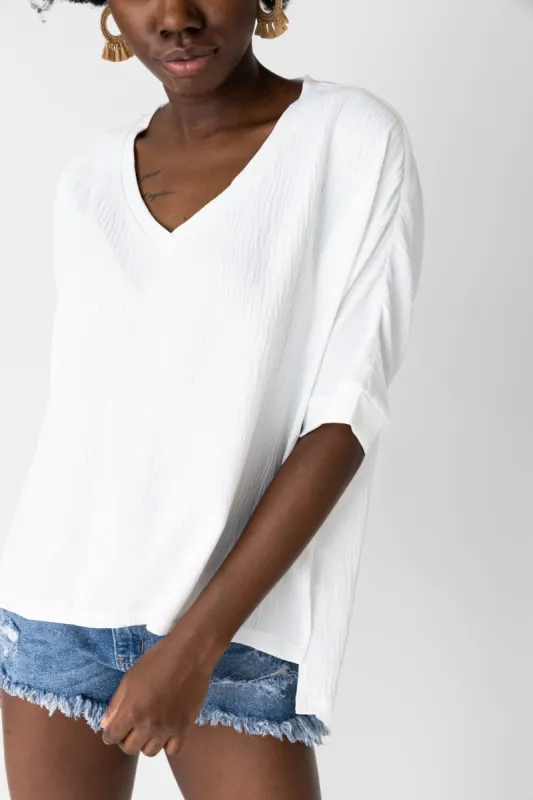 Aria Woven V Neck Top sold by fab'rik