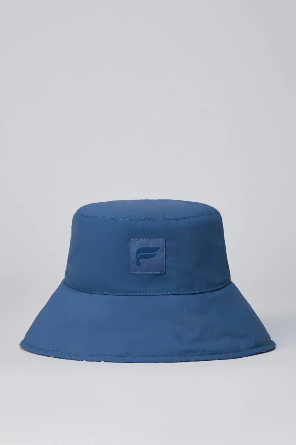 The Maxi Cabas Reversible Bucket Hat sold by Fabletics