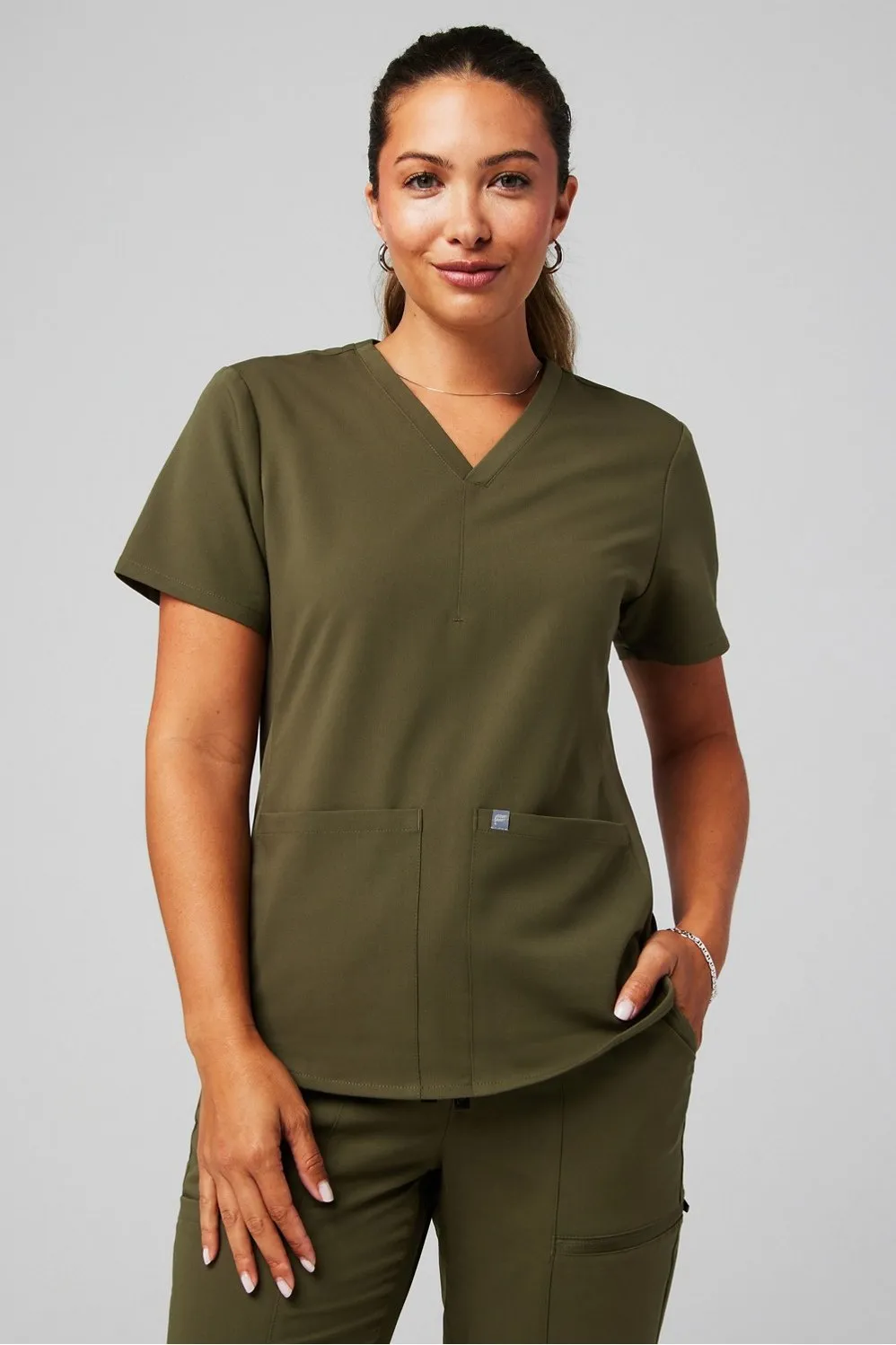 Method Flex 2-Pocket Scrub Top sold by Fabletics