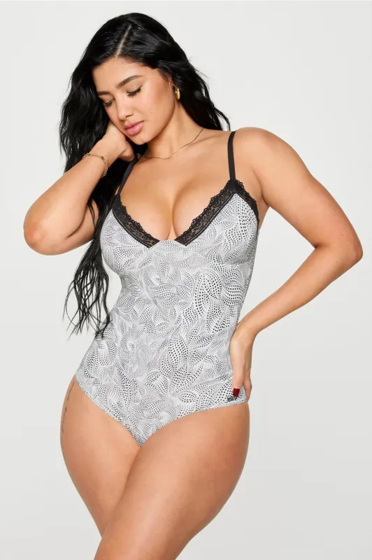 Smoothed Reality Lace Brief Bodysuit sold by Fabletics