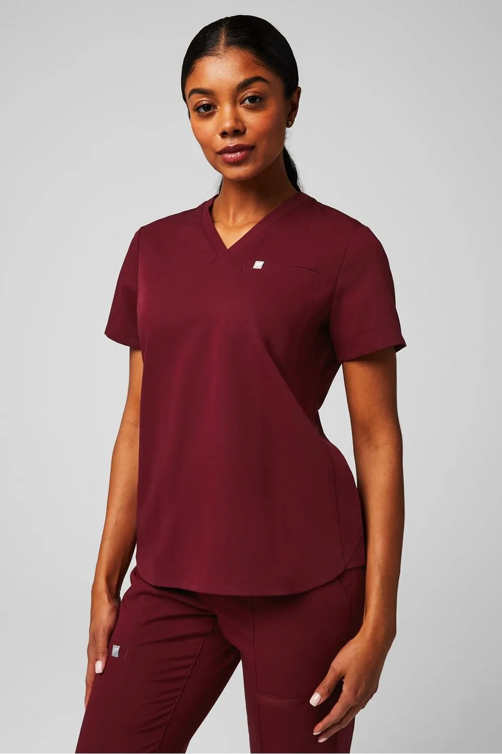 Vital 1-Pocket Scrub Top sold by Fabletics