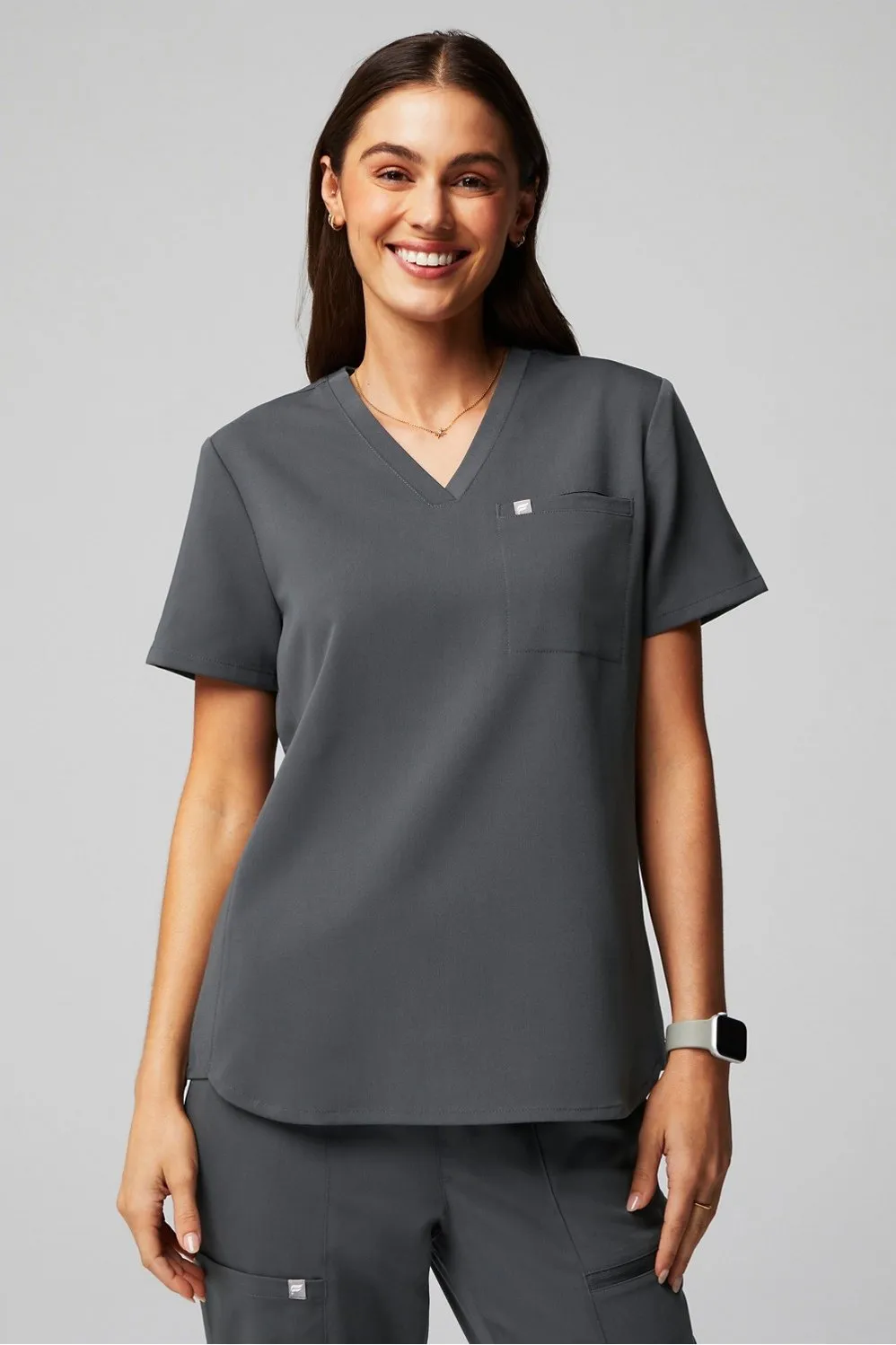 Vital 1-Pocket Scrub Top sold by Fabletics