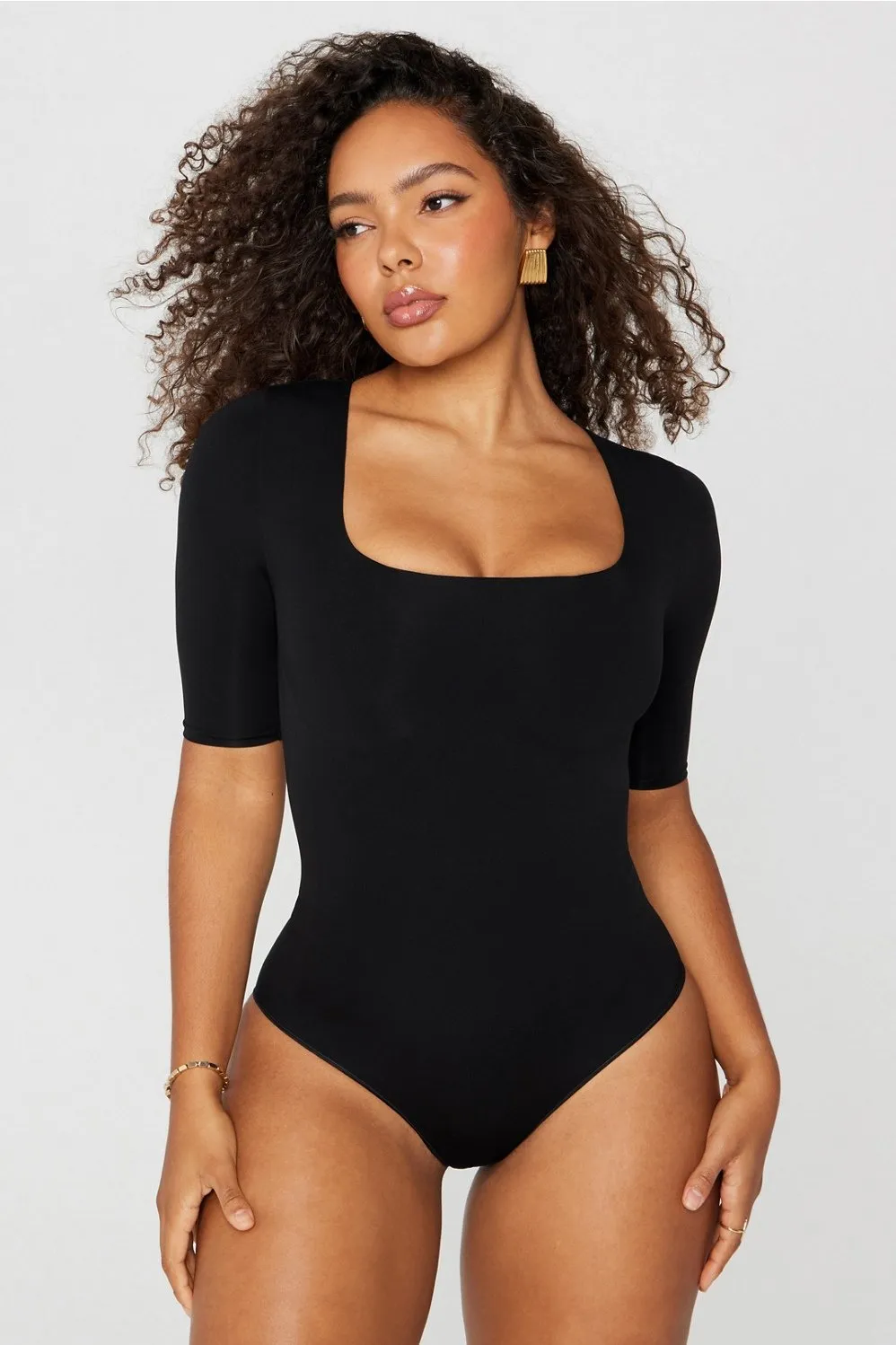 Nearly Naked Shapewear 3/4 Sleeve Bodysuit sold by Fabletics