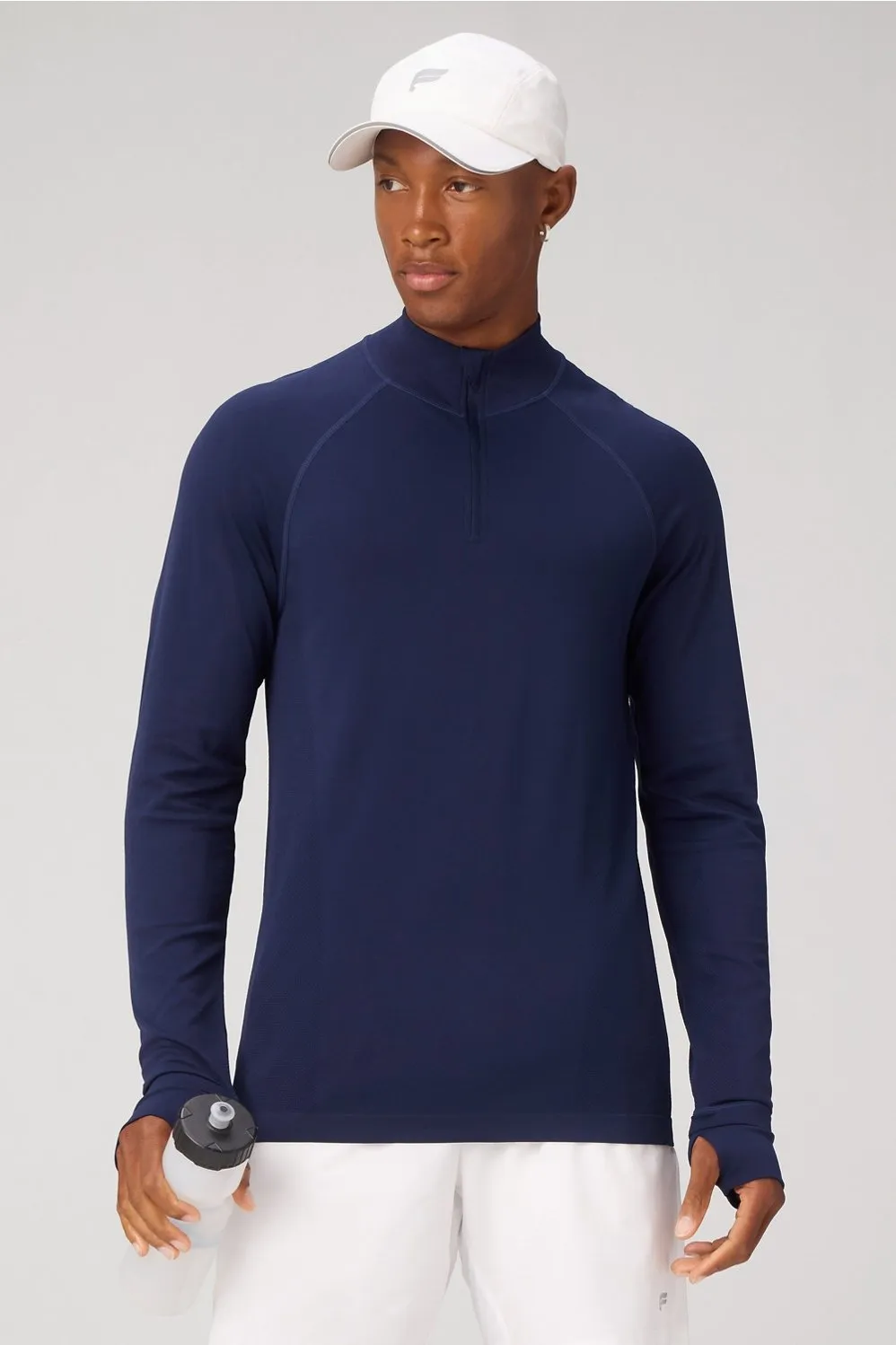 The Training Day Quarter Zip sold by Fabletics