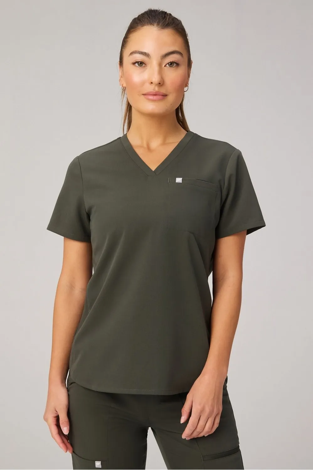 Vital 1-Pocket Scrub Top sold by Fabletics