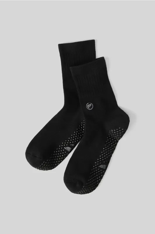 The Powerhouse Quarter Crew Grip Sock sold by Fabletics