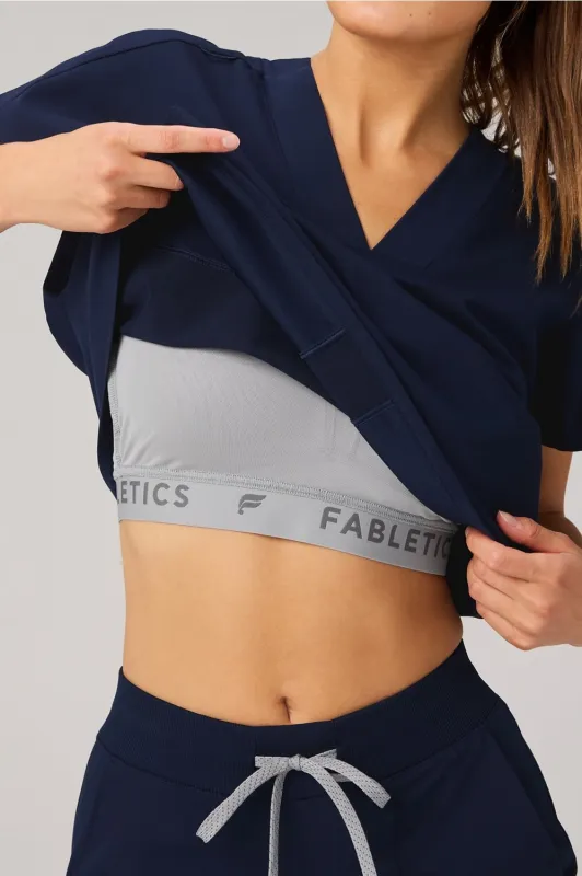 360° Built-In Bra Scrub Top sold by Fabletics