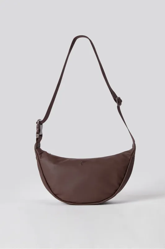 The Vegan Leather Sling Bag sold by Fabletics