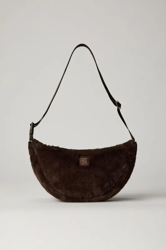The Faux Fur Sling Bag sold by Fabletics