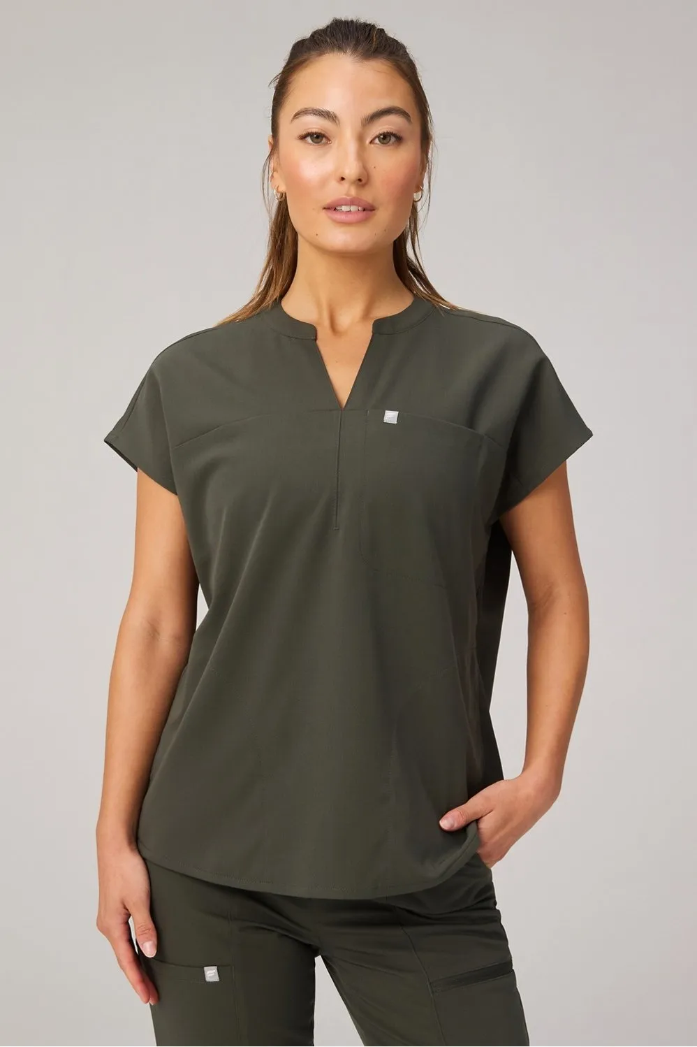 Evolve Oversized Scrub Top sold by Fabletics