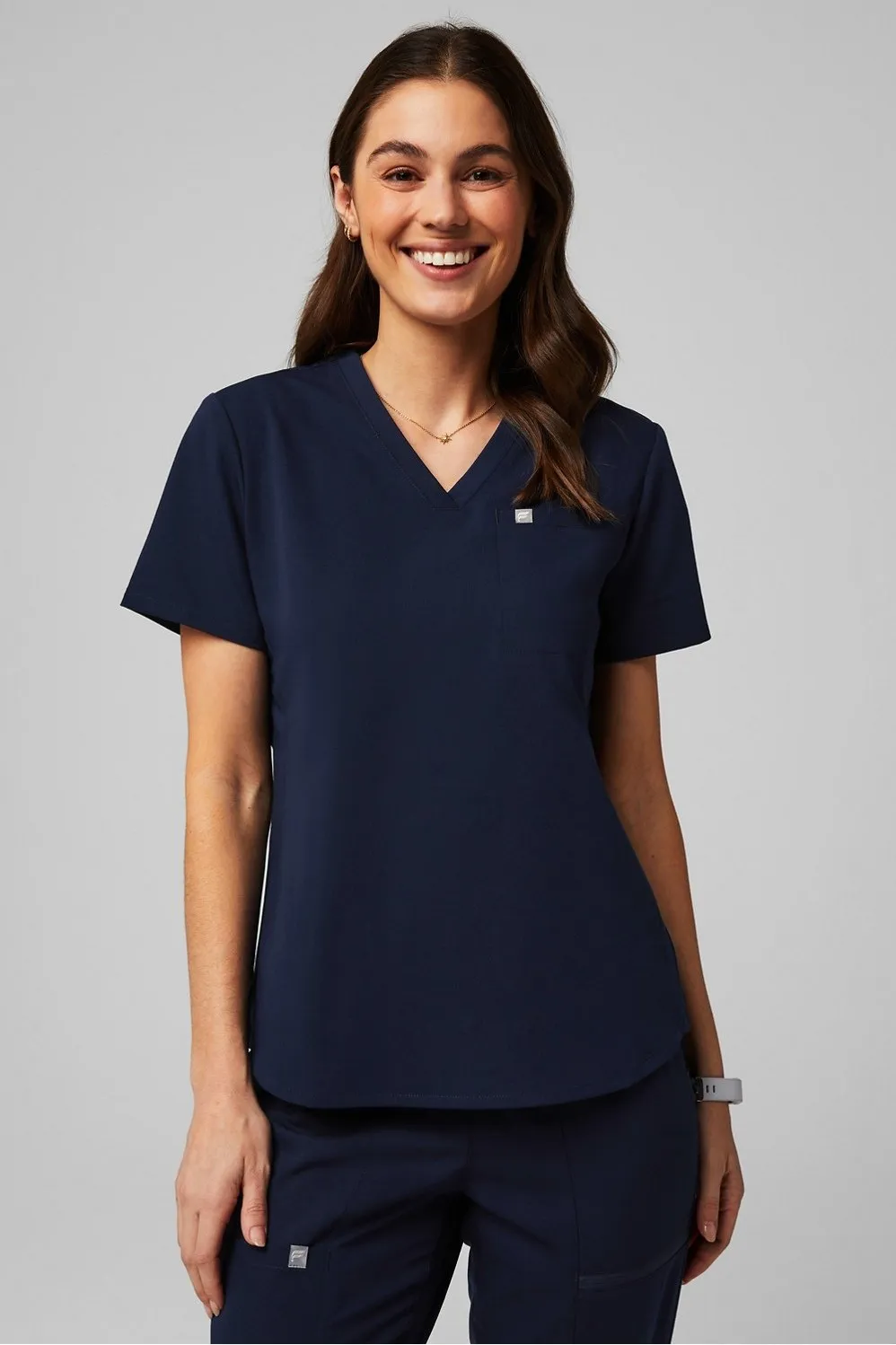 Vital 1-Pocket Scrub Top sold by Fabletics