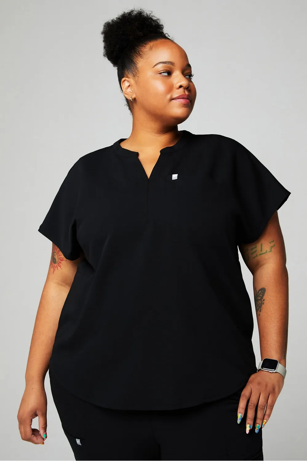Evolve Scrub Top sold by Fabletics