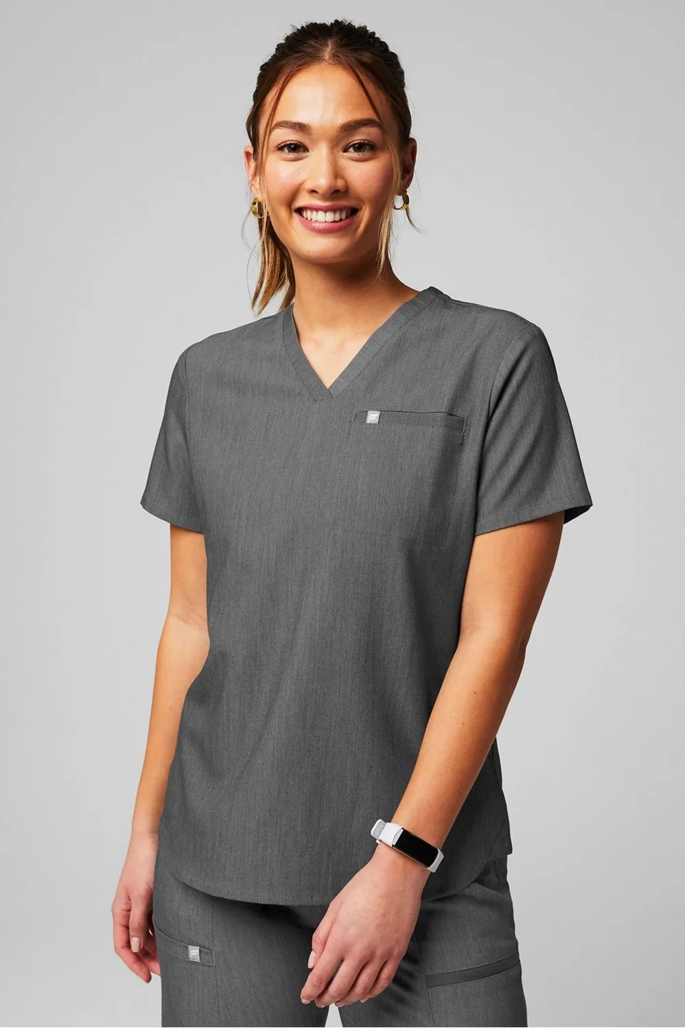Vital 1-Pocket Scrub Top sold by Fabletics