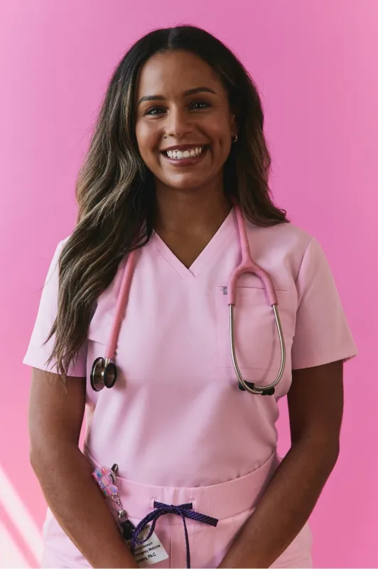 Vital 1-Pocket Scrub Top sold by Fabletics