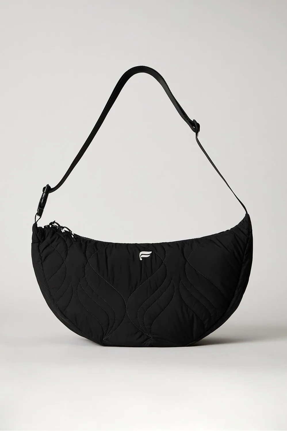 The Quilted Large Sling Bag sold by Fabletics