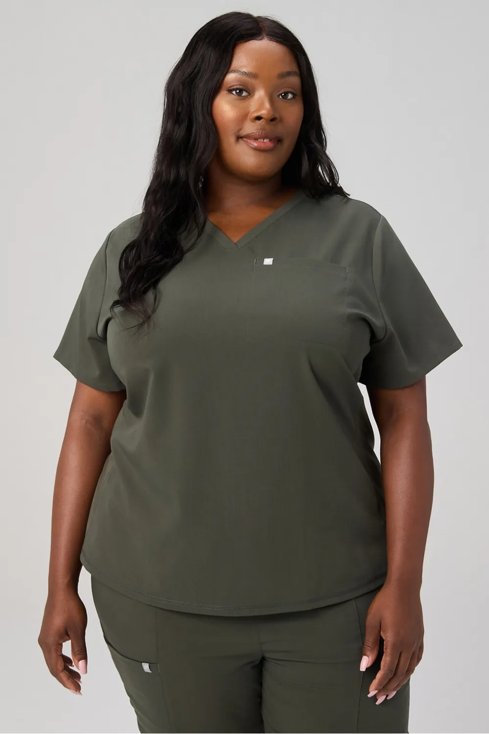Vital Flex 1-Pocket Scrub Top sold by Fabletics