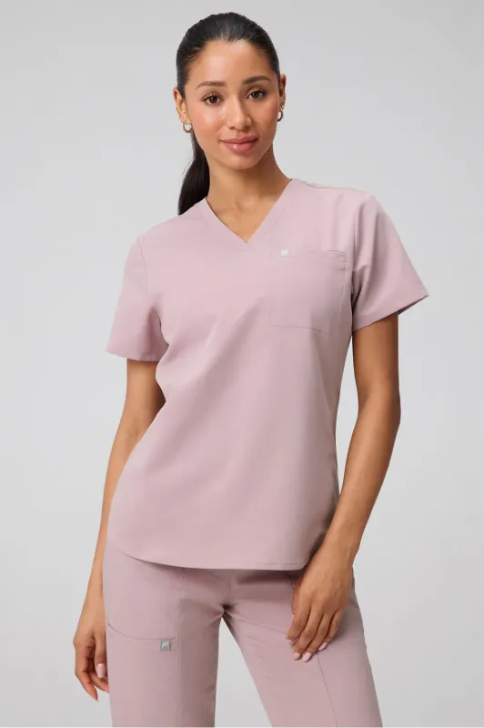 Vital 1-Pocket Scrub Top sold by Fabletics