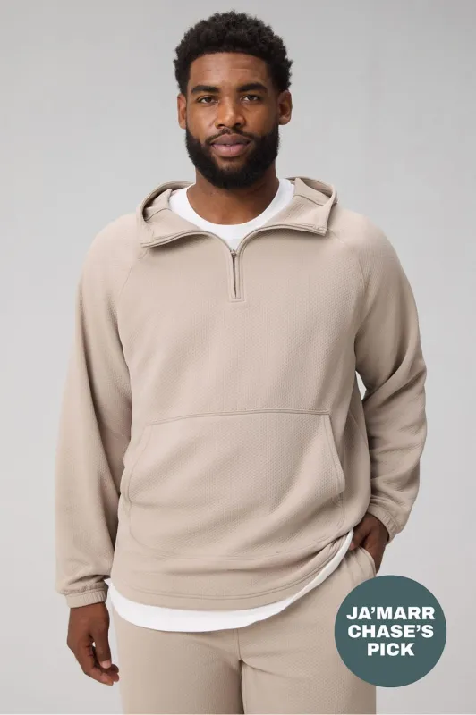 The GridTech Quarter Zip Hoodie sold by Fabletics