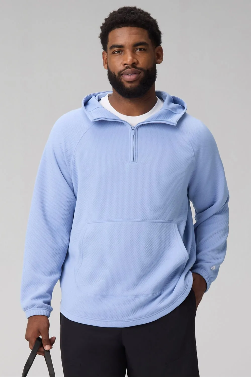 The GridTech Quarter Zip Hoodie sold by Fabletics