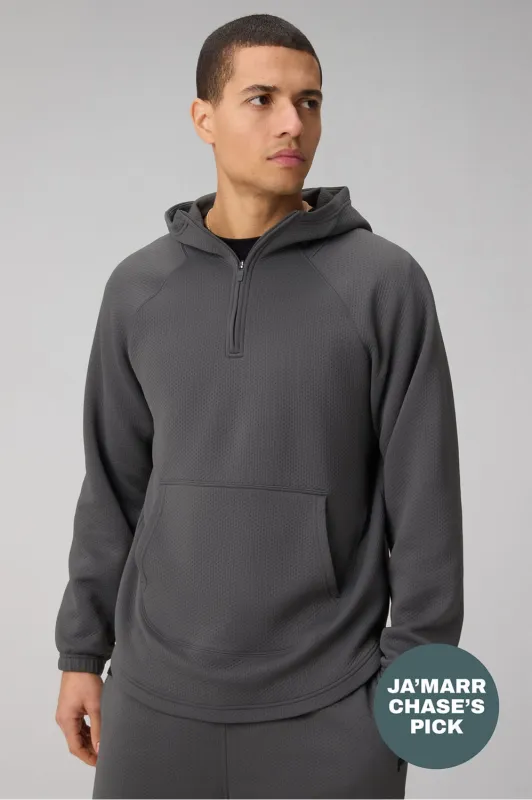 The GridTech Quarter Zip Hoodie sold by Fabletics