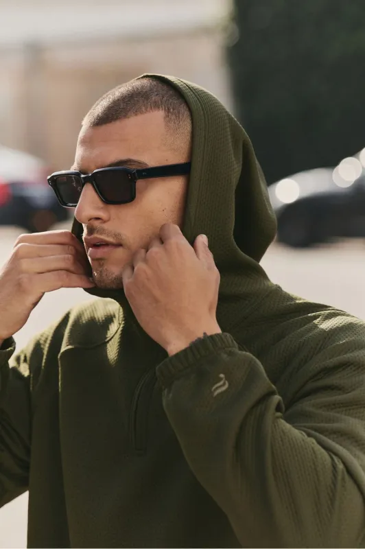 The GridTech Quarter Zip Hoodie sold by Fabletics