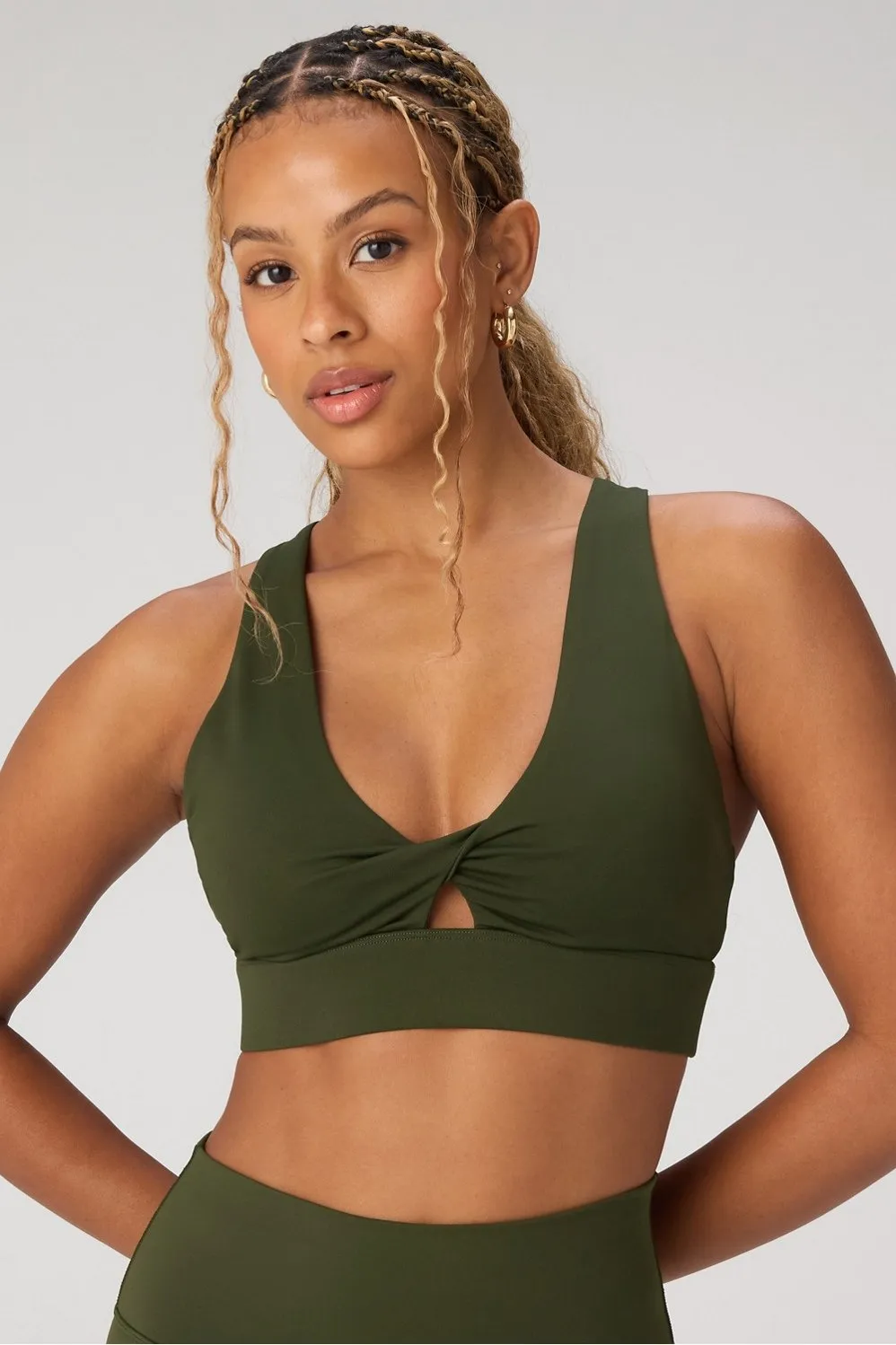 Oasis Twist Medium Impact Sports Bra sold by Fabletics