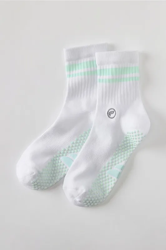The Powerhouse Quarter Crew Grip Sock sold by Fabletics