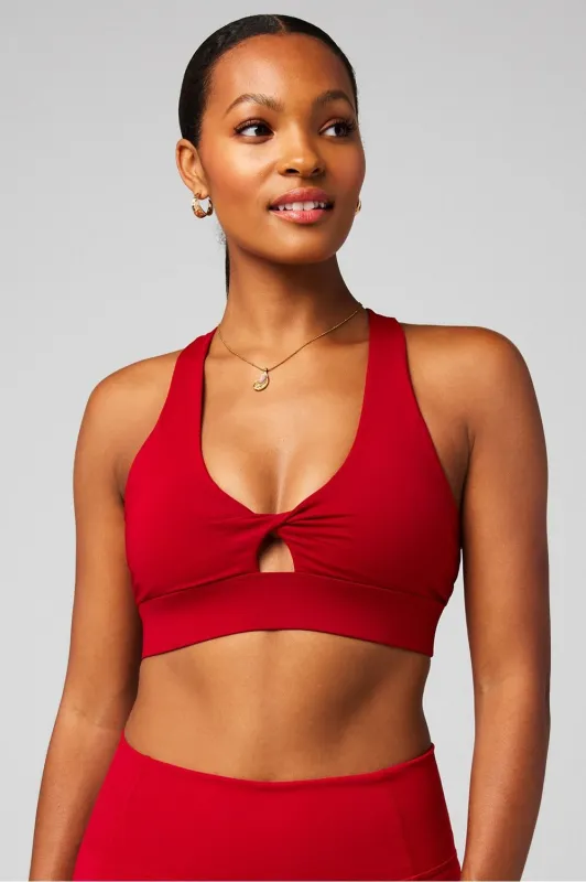 Oasis Twist Medium Impact Sports Bra sold by Fabletics
