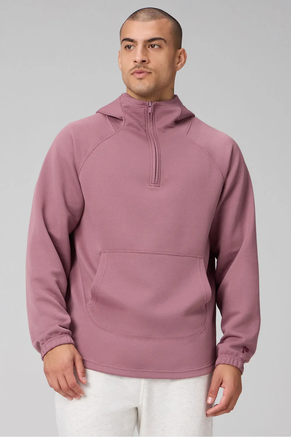 The GridTech Quarter Zip Hoodie sold by Fabletics