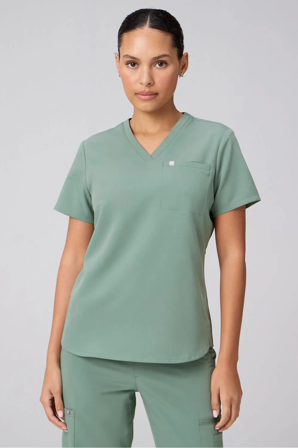 Vital 1-Pocket Scrub Top sold by Fabletics