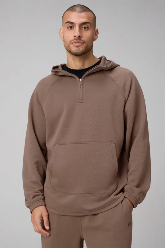 The GridTech Quarter Zip Hoodie made by Fabletics