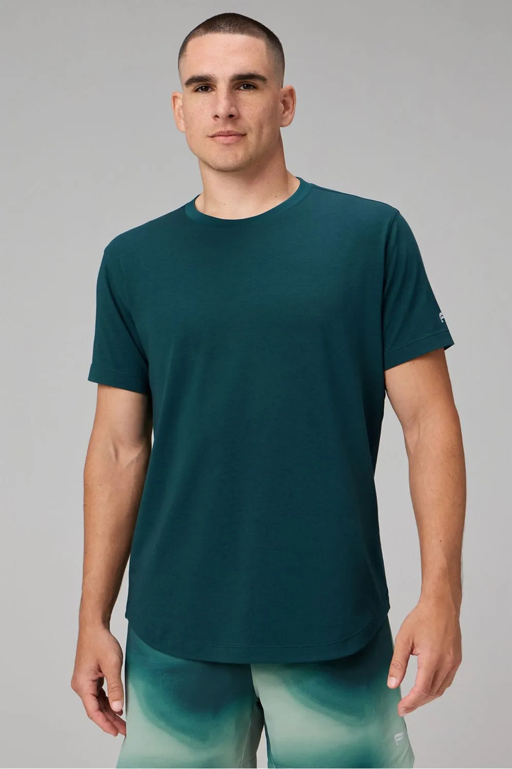 The 24-7 Tee (Curved Hem) sold by Fabletics