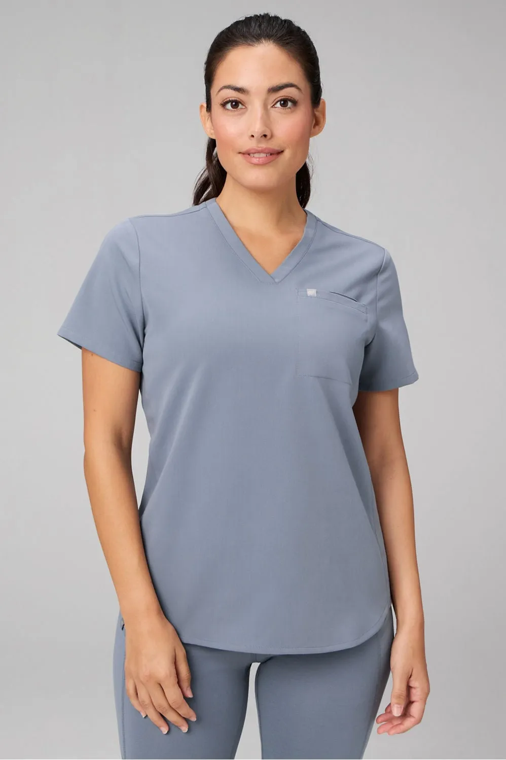 Vital 1-Pocket Scrub Top sold by Fabletics
