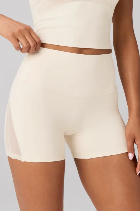 The No-Seam PureLuxe TLC Mesh Short 4" made by Fabletics