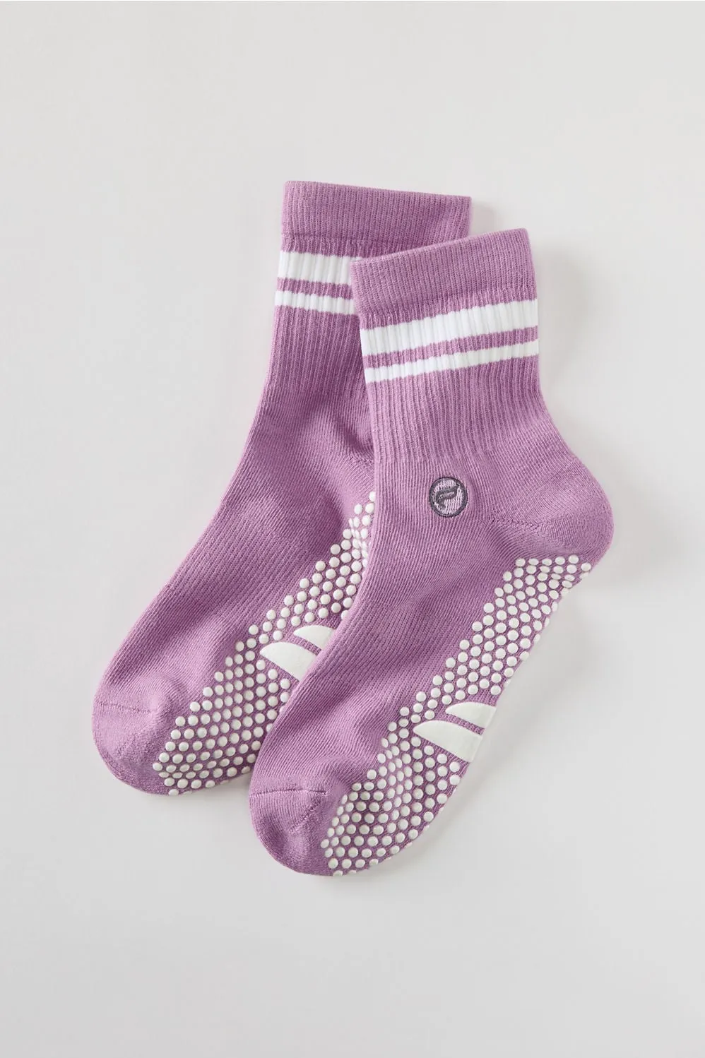 The Powerhouse Quarter Crew Grip Sock sold by Fabletics