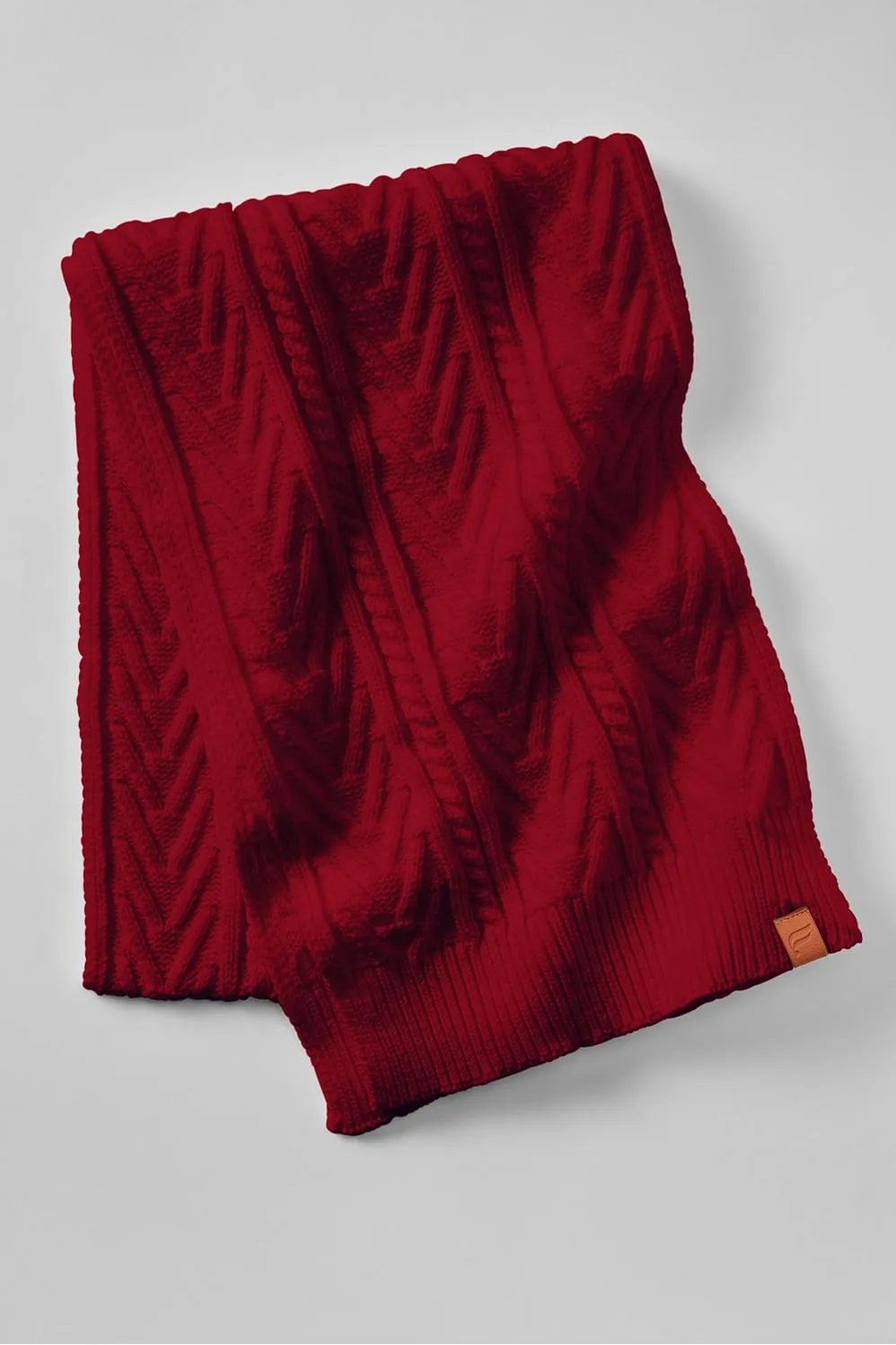 The Cable Knit Scarf sold by Fabletics