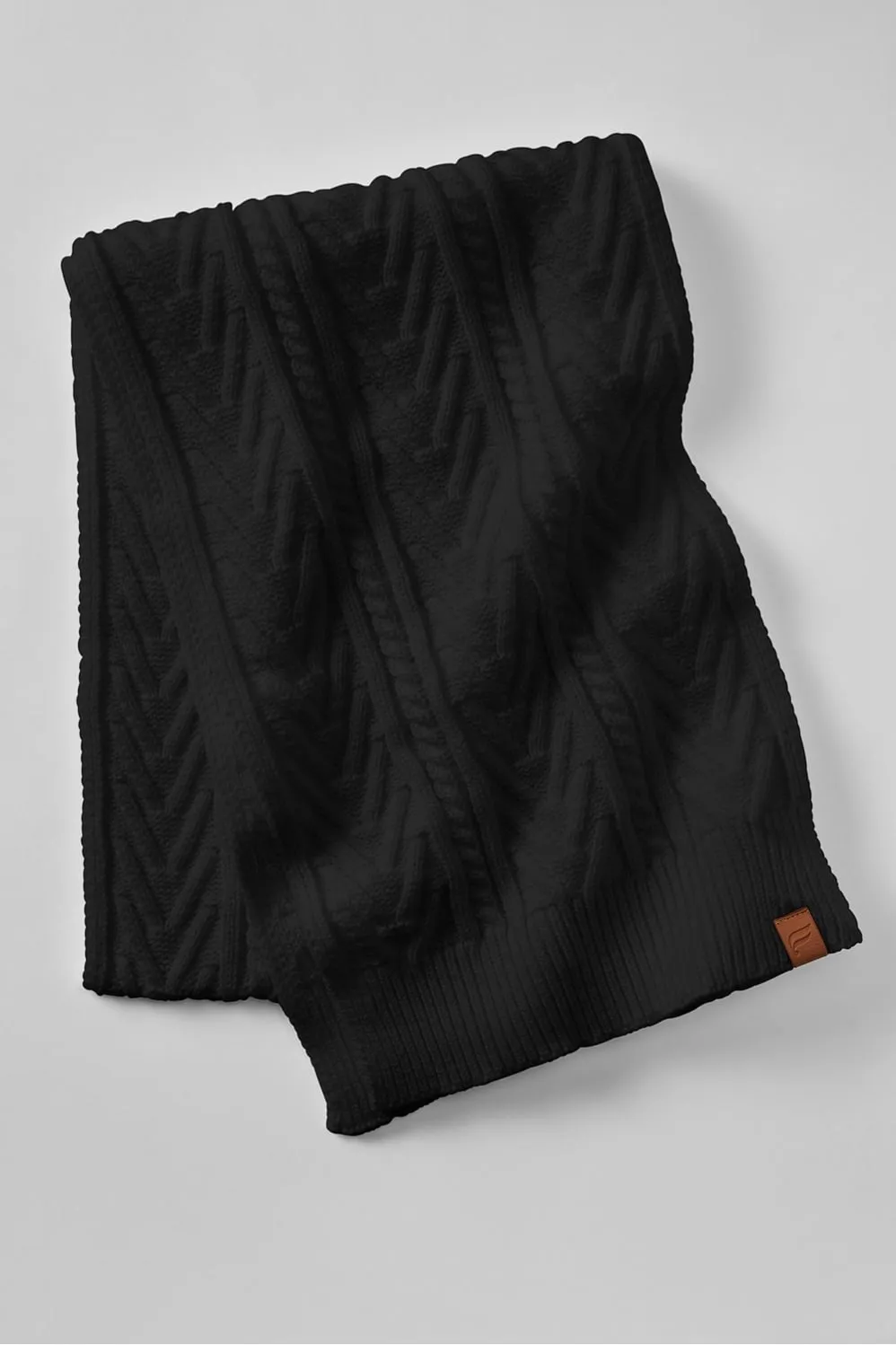 The Cable Knit Scarf sold by Fabletics