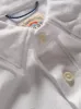 Movement™ Short-Sleeve Pique Polo Shirt - Pure White sold by Faherty