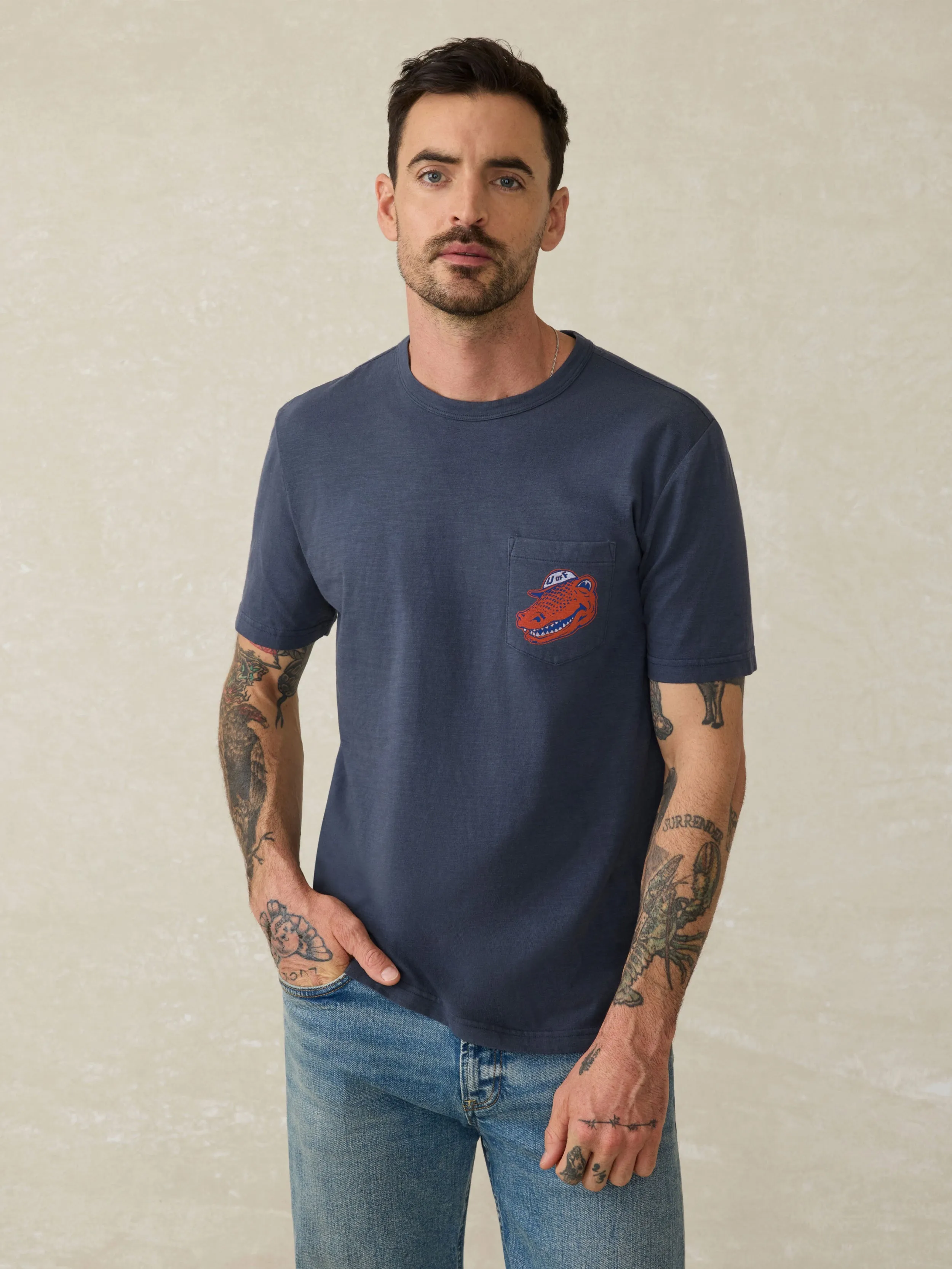 University of Florida Sunwashed Pocket Tee - Dune Navy sold by Faherty