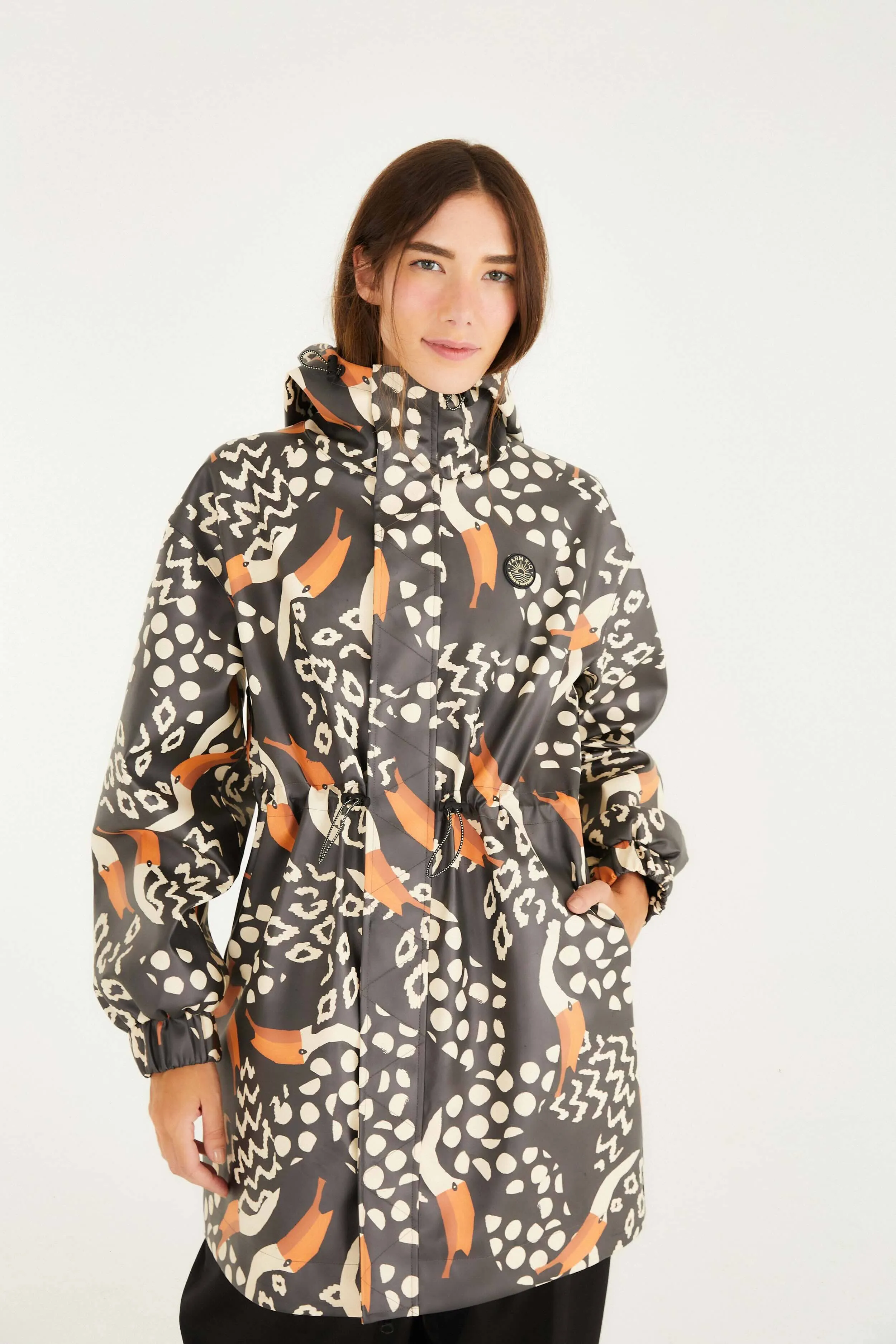 Black Tucanismo Raincoat sold by FARM Rio