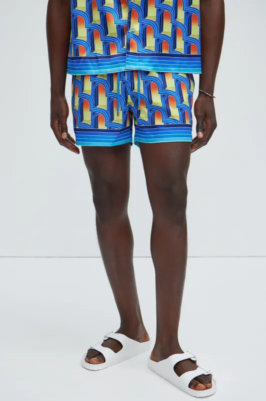 Cowan Geometric Swim Trunks - Blue/combo sold by Fashion Nova