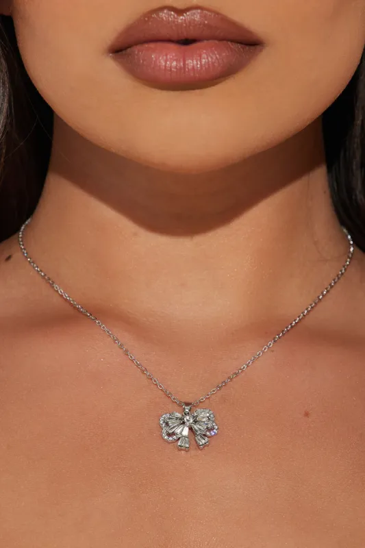 Cutie With The Bow Necklace - Silver sold by Fashion Nova