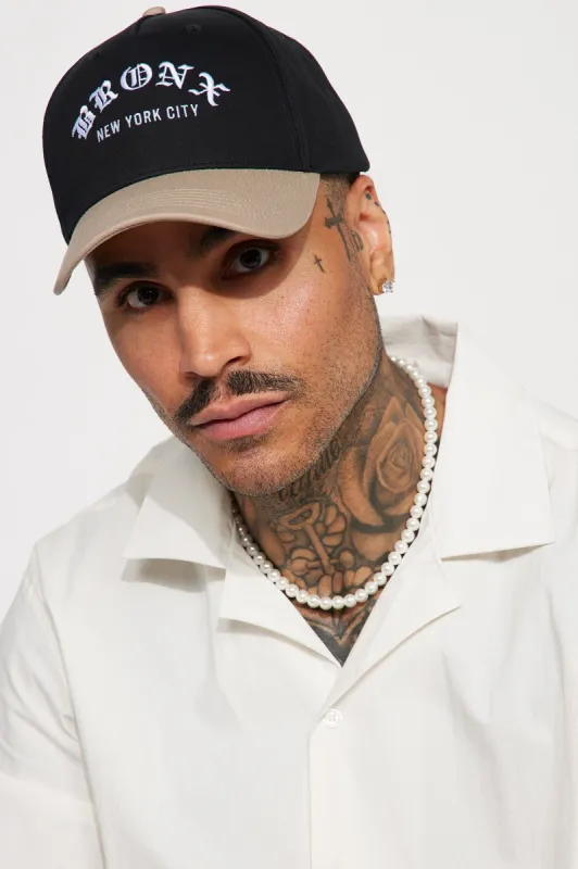 The Bronx Snapback Hat - Black/combo sold by Fashion Nova