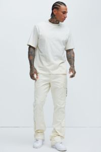 Nikko Slim Flare Pants - Cream sold by Fashion Nova